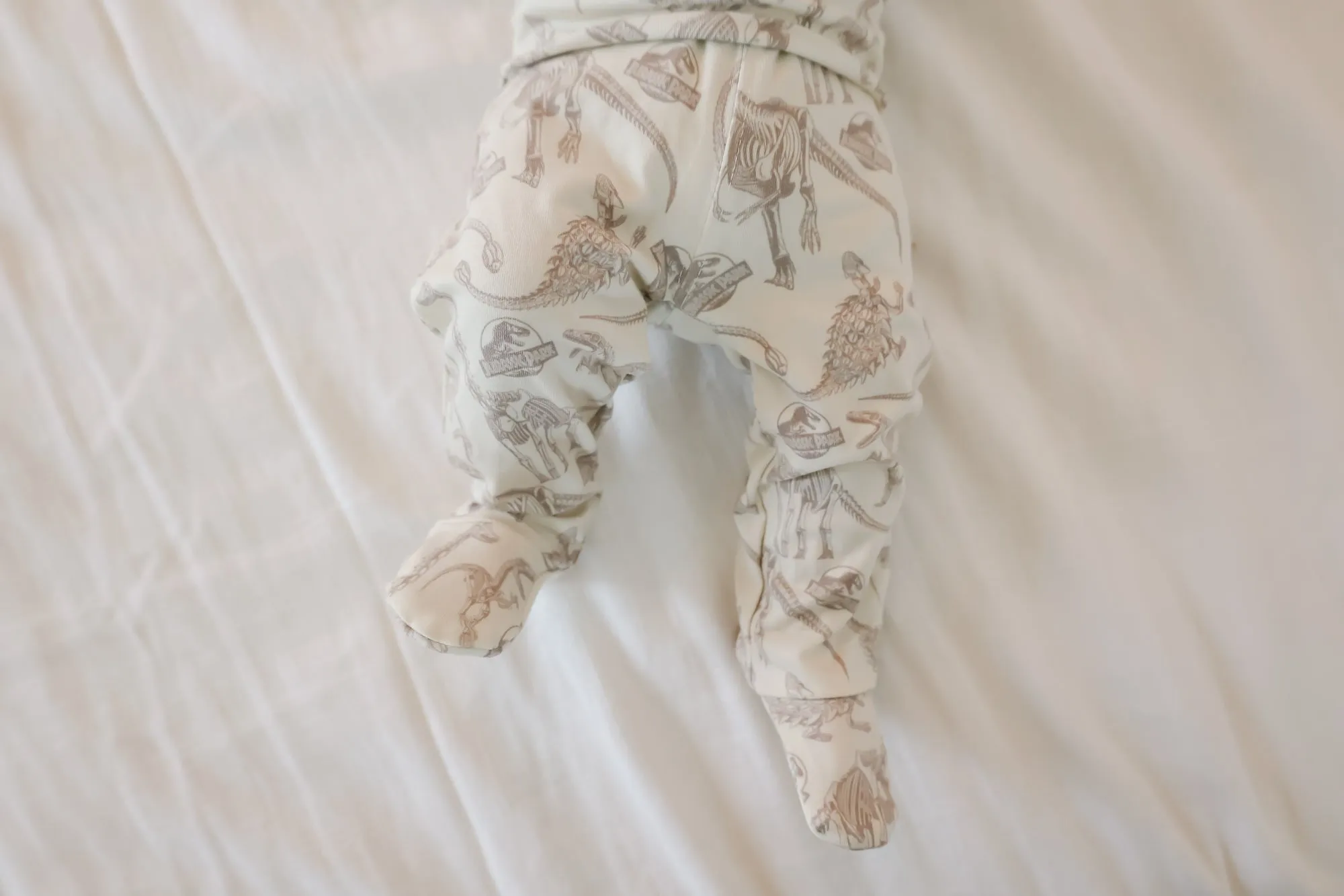 Footed Baby Pants - Jurassic Park Fossils